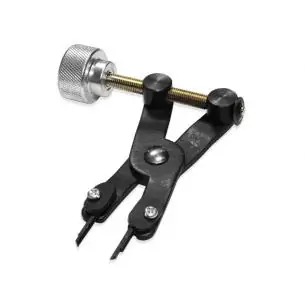 Przyrząd do zwalniania naprężonych sprzęgieł dwumasowych